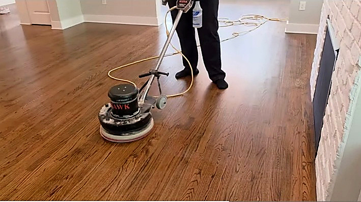 True Clean floor buffer working on hardwood flooring during the Durham Clean and Buff project
