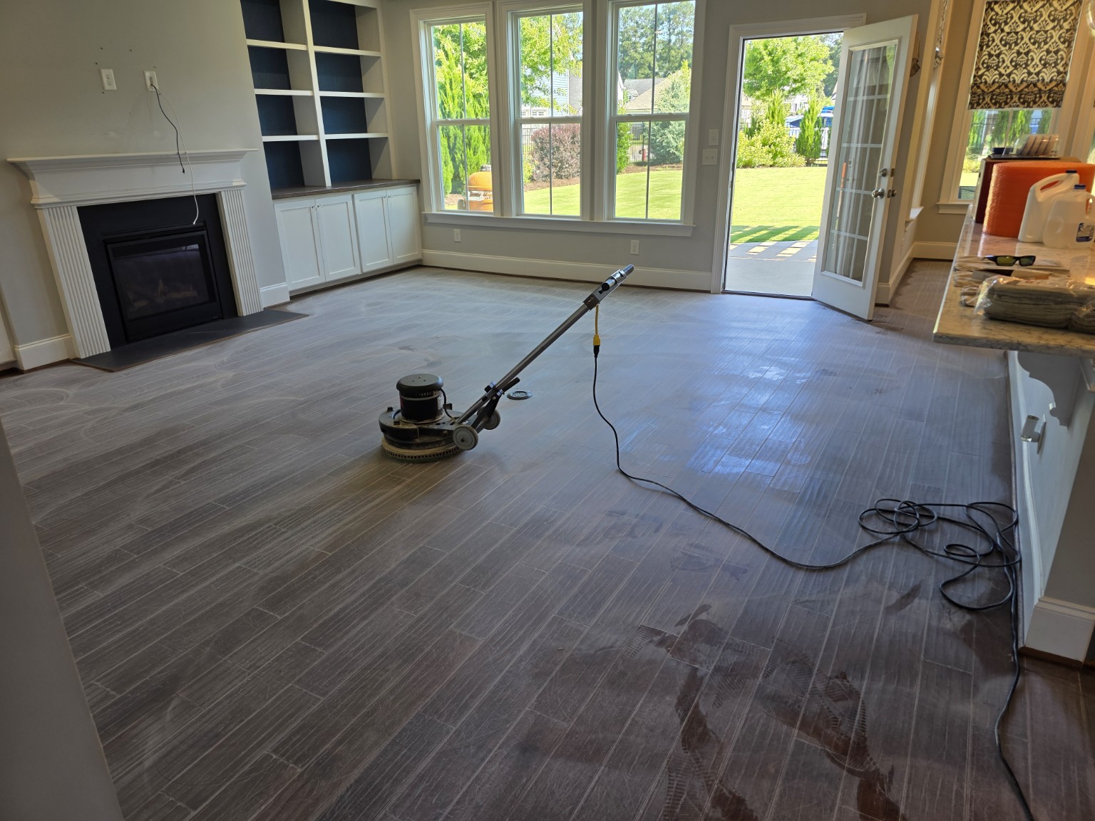 Hardwood floor screening machine in use