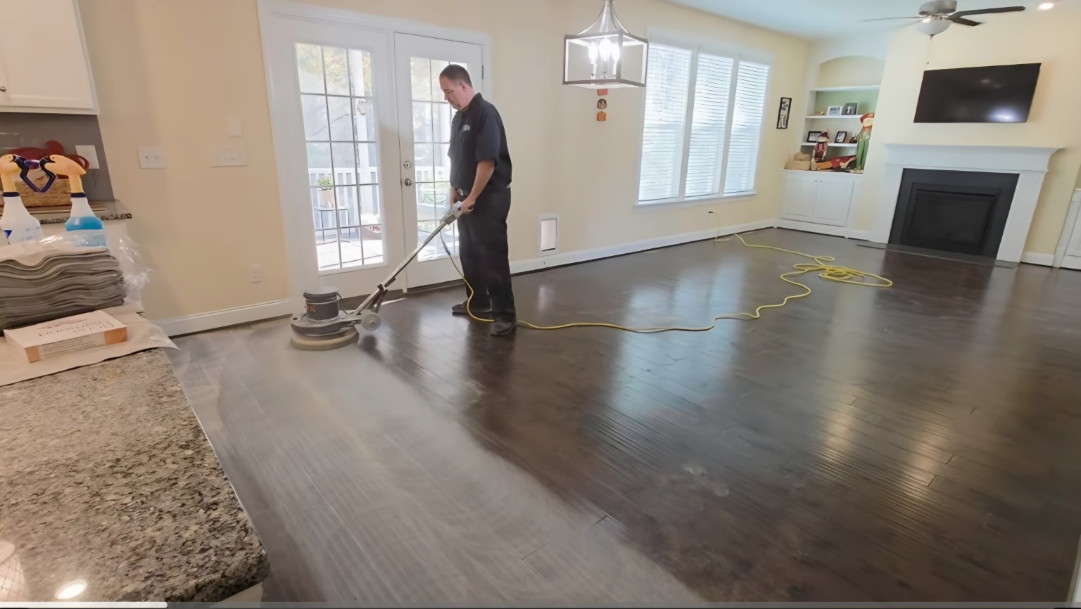 Screening a hardwood floor with a professional floor buffer