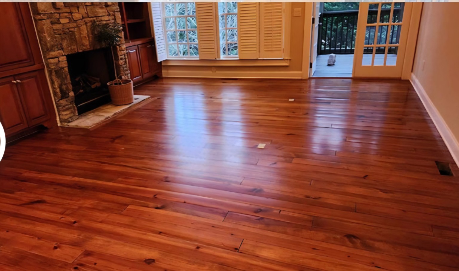After — Wide-plank hardwood restoration